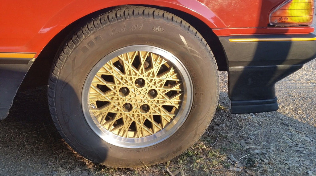 FORD XE ESP Fairmont Ghia GOLD SNOWFLAKE set of 4 centre caps NEW INJE ...
